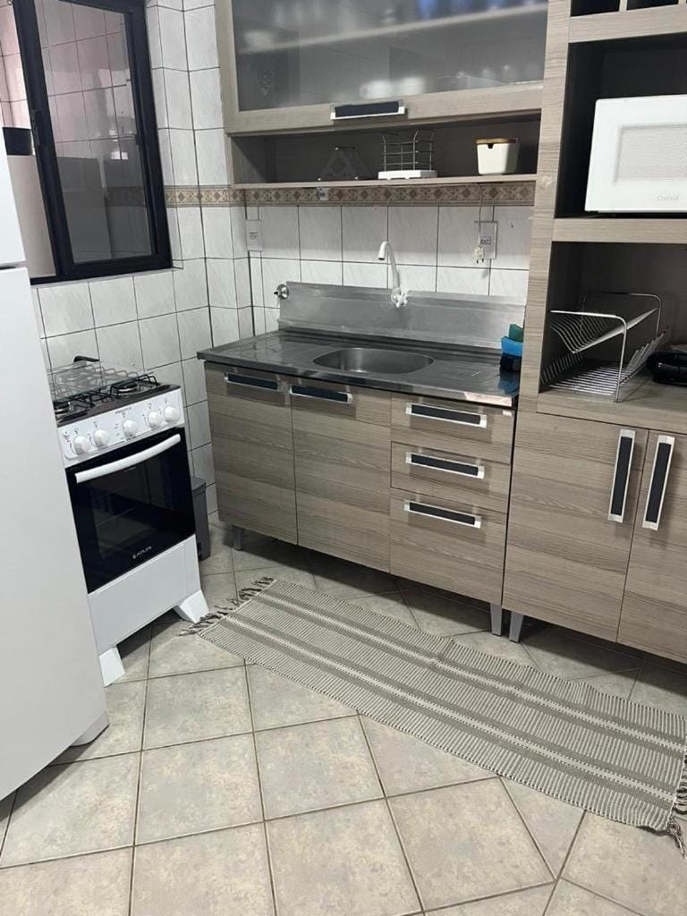 Apartamento na melhor localização da meia praia em itapema com garagem para camioneta suv Apartment in Porto Belo