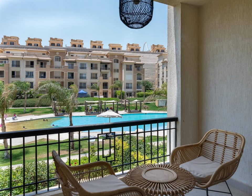 View (from property/room), Balcony/Terrace, Seating area, Pool view, Swimming pool