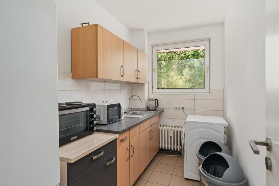 Kitchen or kitchenette, washing machine