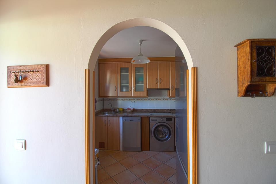 Kitchen or kitchenette, washing machine