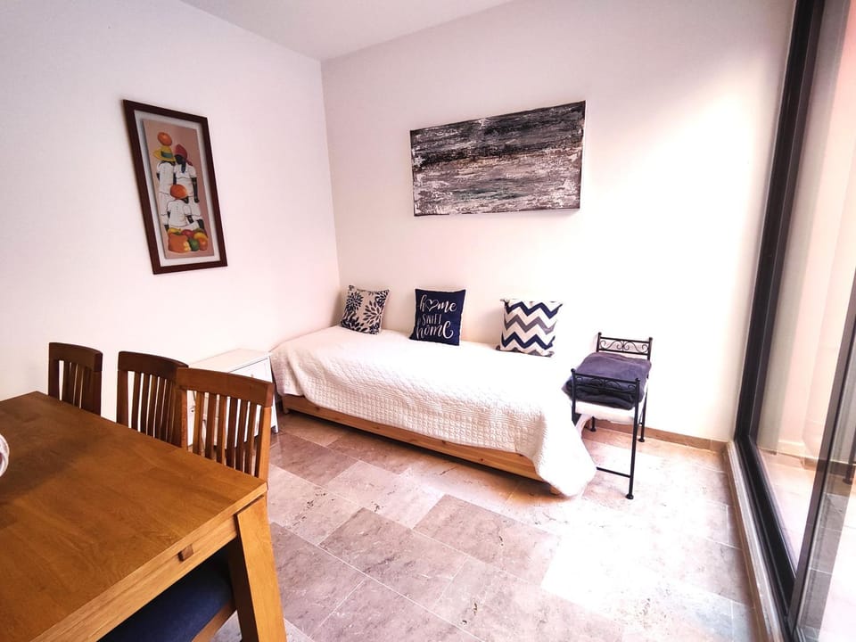 Bed, Living room, Seating area, Dining area