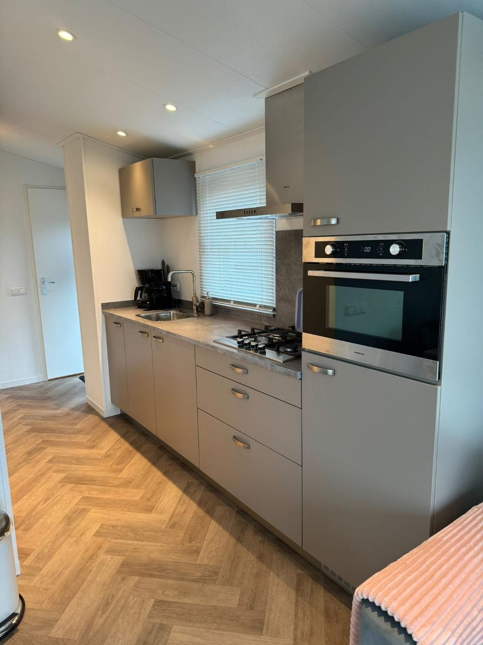 Kitchen or kitchenette, dishwasher, oven, stove