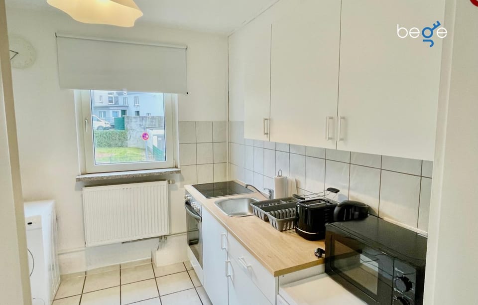 Kitchen or kitchenette, dishwasher, stove, toaster