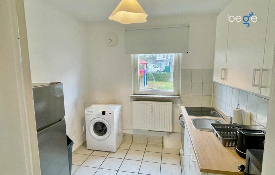 Kitchen or kitchenette, dishwasher, oven, stove, washing machine