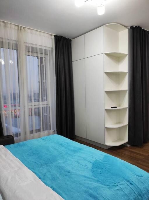 52 напротив ТРЦ MEGA возле гор Apartment in Almaty