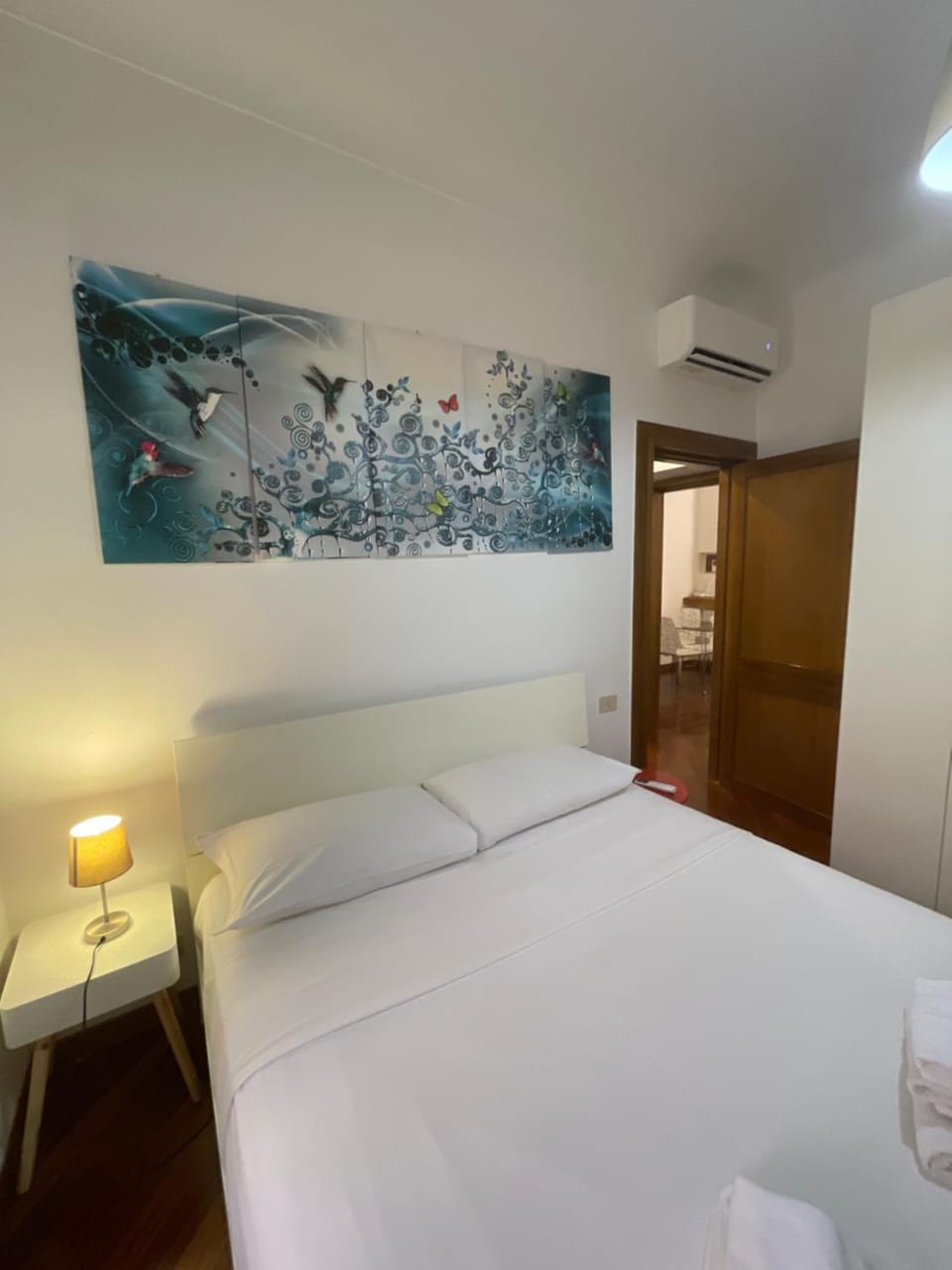 Bed, Photo of the whole room, Decorative detail, Bedroom, towels, wardrobe, air conditioner