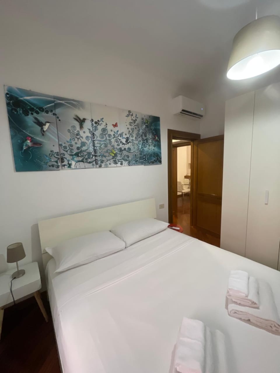 Bed, Photo of the whole room, Decorative detail, Bedroom, towels, wardrobe, air conditioner