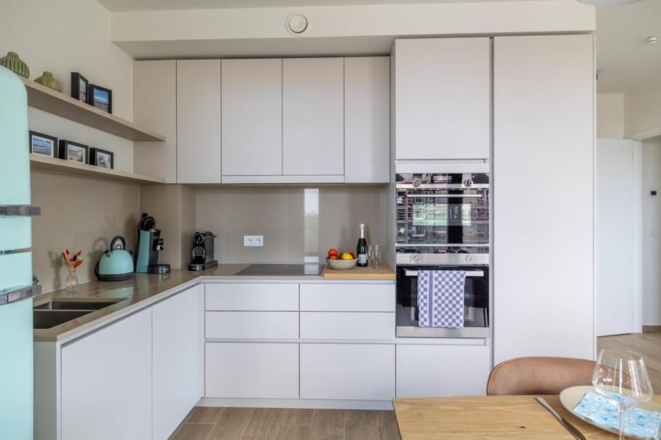 Kitchen or kitchenette, dishwasher, oven, stove, toaster
