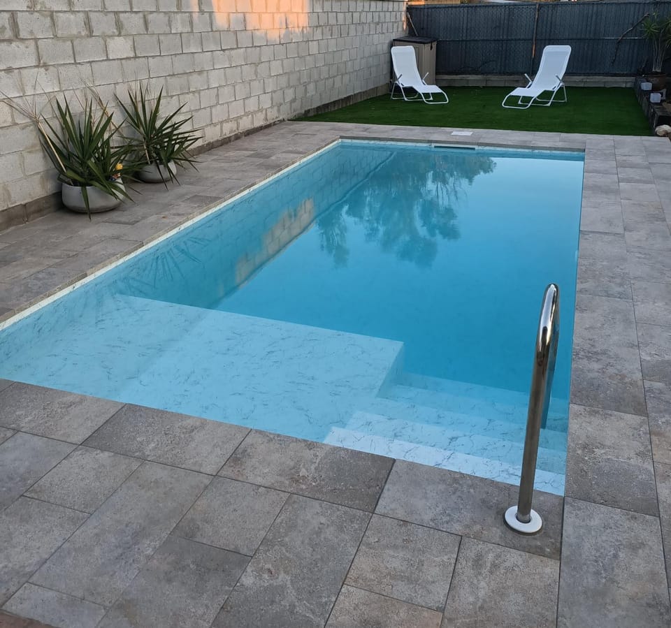 Swimming pool, sunbed