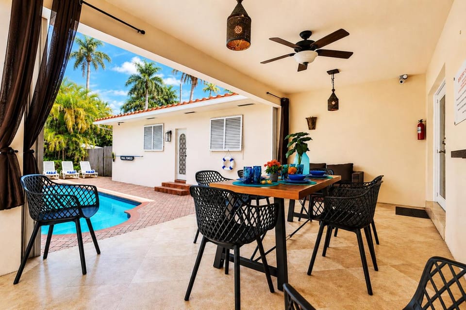 Property building, Patio, Seating area, Dining area, Swimming pool, sunbed