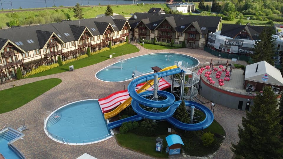 Off site, Natural landscape, Bird's eye view, BBQ facilities, Children play ground, Children play ground, Garden, Hot Spring Bath, Hot Tub, Spa and wellness centre/facilities, Food and drinks, Aqua park, Aqua park, Diving, Diving, Pool view, Swimming pool, Sunset, Open Air Bath