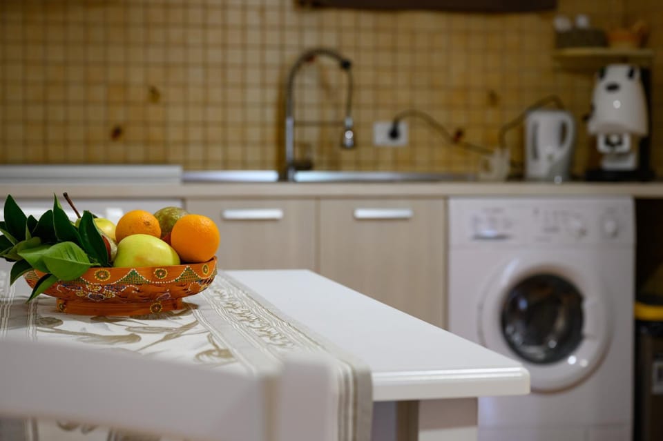 Kitchen or kitchenette, stove, washing machine