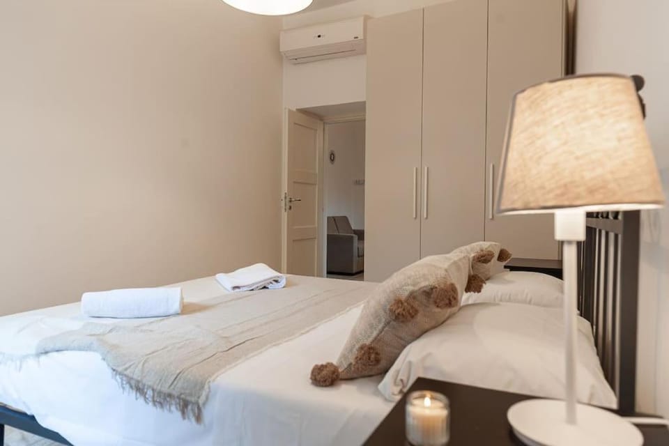 Bed, Bedroom, towels, wardrobe, air conditioner