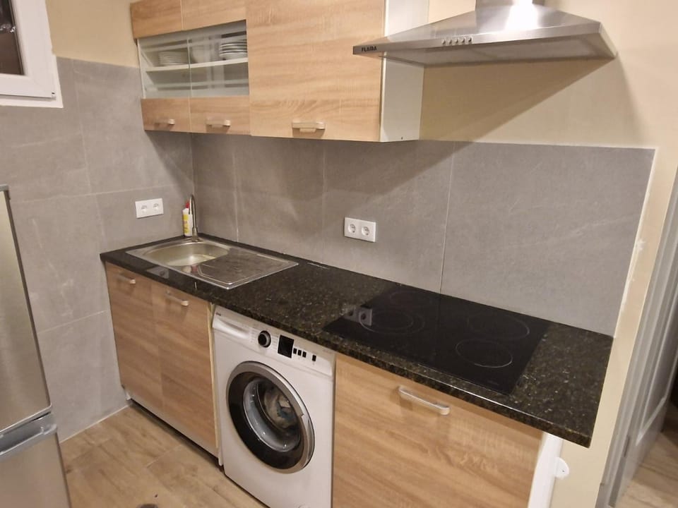Kitchen or kitchenette, stove, washing machine
