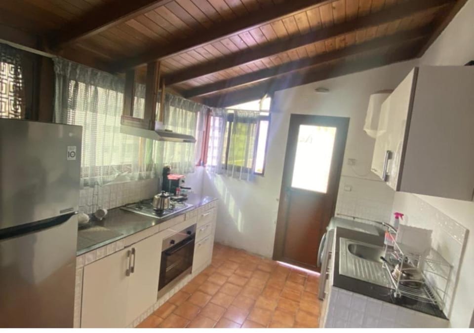 Kitchen or kitchenette, dishwasher, oven, stove