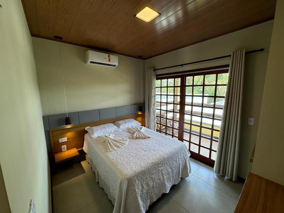 Bed, Photo of the whole room, Bedroom, towels, air conditioner