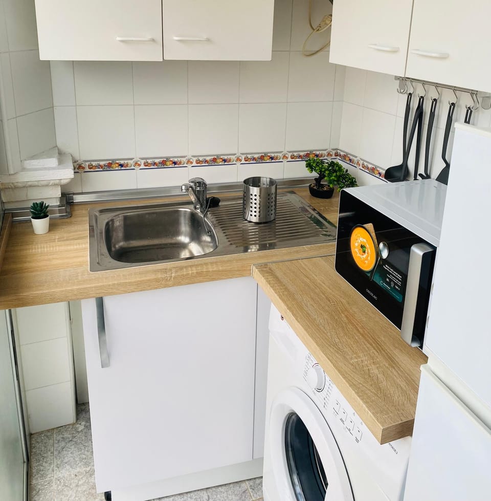 Kitchen or kitchenette, microwave, toaster, washing machine