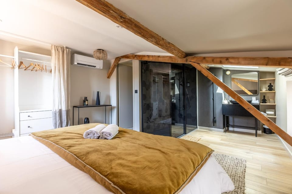 Shower, Bed, Bathroom, Photo of the whole room, Bedroom, hair dryier, storage, towels, air conditioner