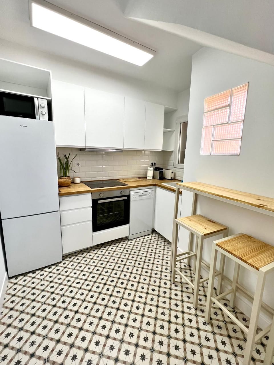 Kitchen or kitchenette, dishwasher, oven, stove
