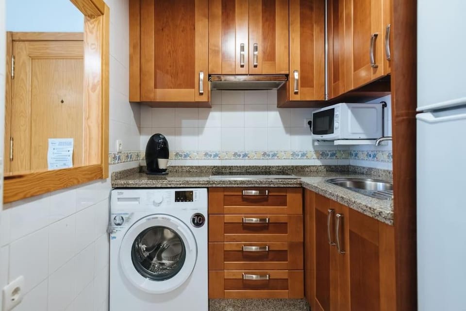 Kitchen or kitchenette, washing machine