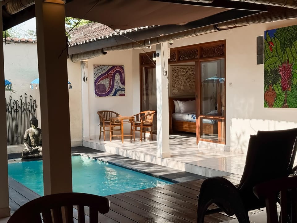 Patio, Living room, Seating area, Pool view, Swimming pool