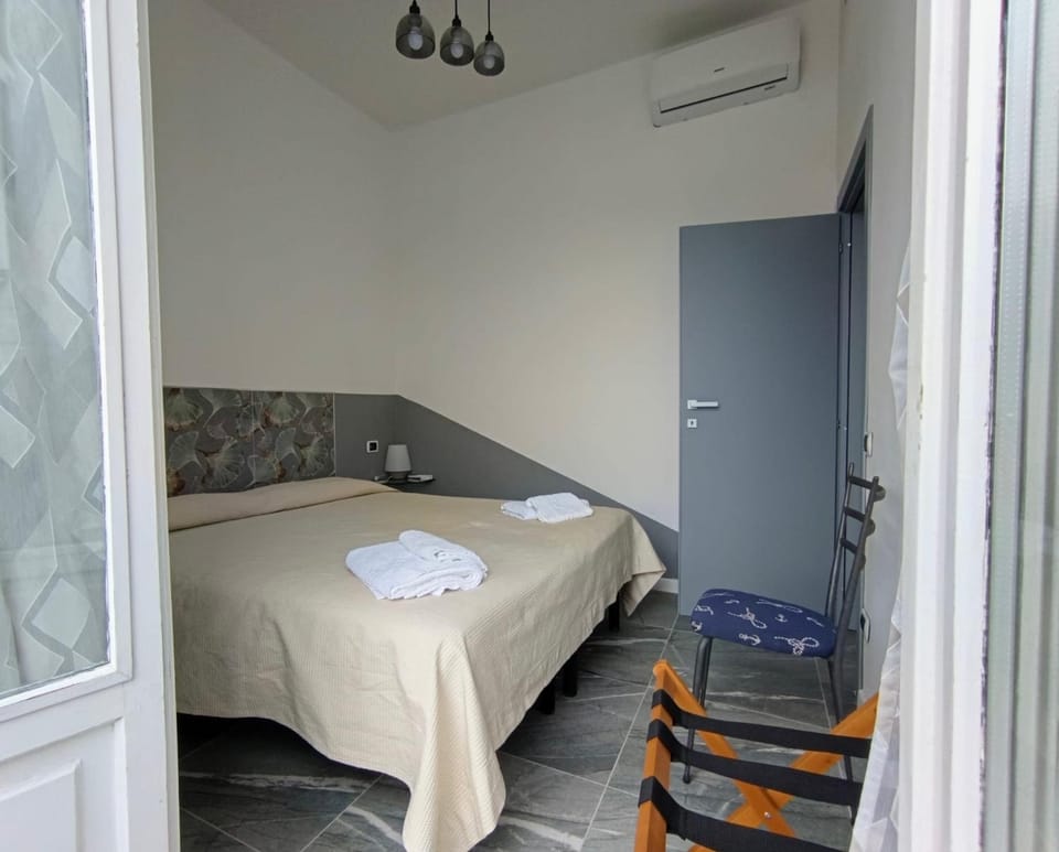 Bed, Photo of the whole room, Bedroom, towels, air conditioner