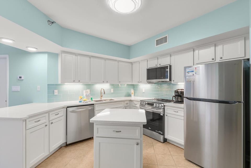 Kitchen or kitchenette, dishwasher, oven, stove