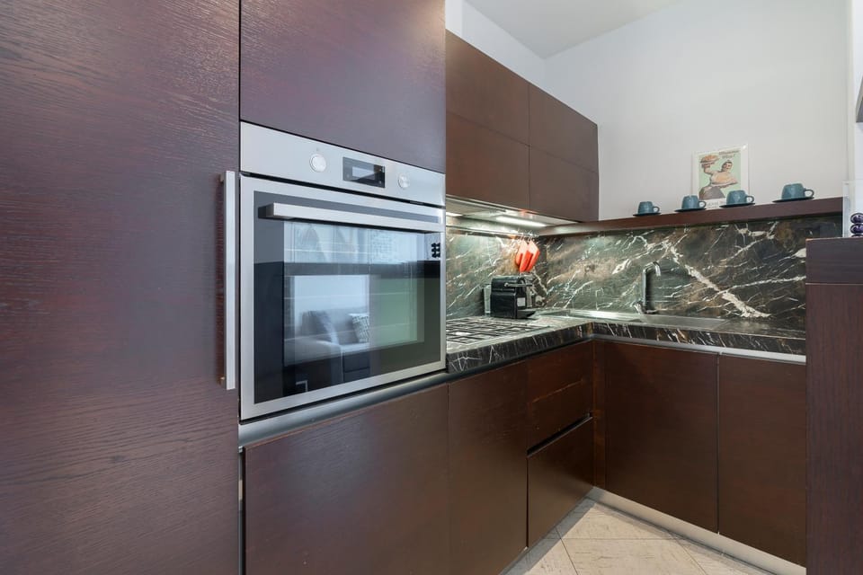 Kitchen or kitchenette, dishwasher, oven, stove