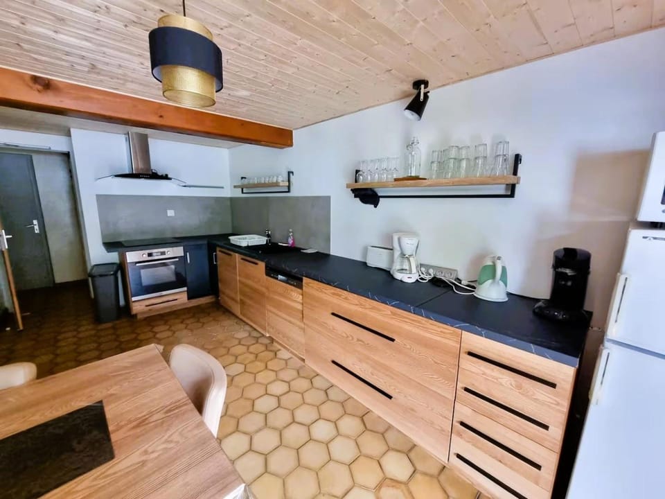 Kitchen or kitchenette, dishwasher, oven, stove