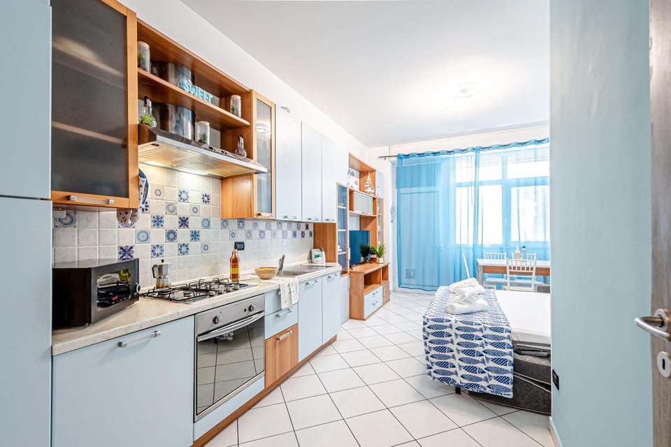 Living room, Dining area, dishwasher, microwave, oven, stove, kitchen