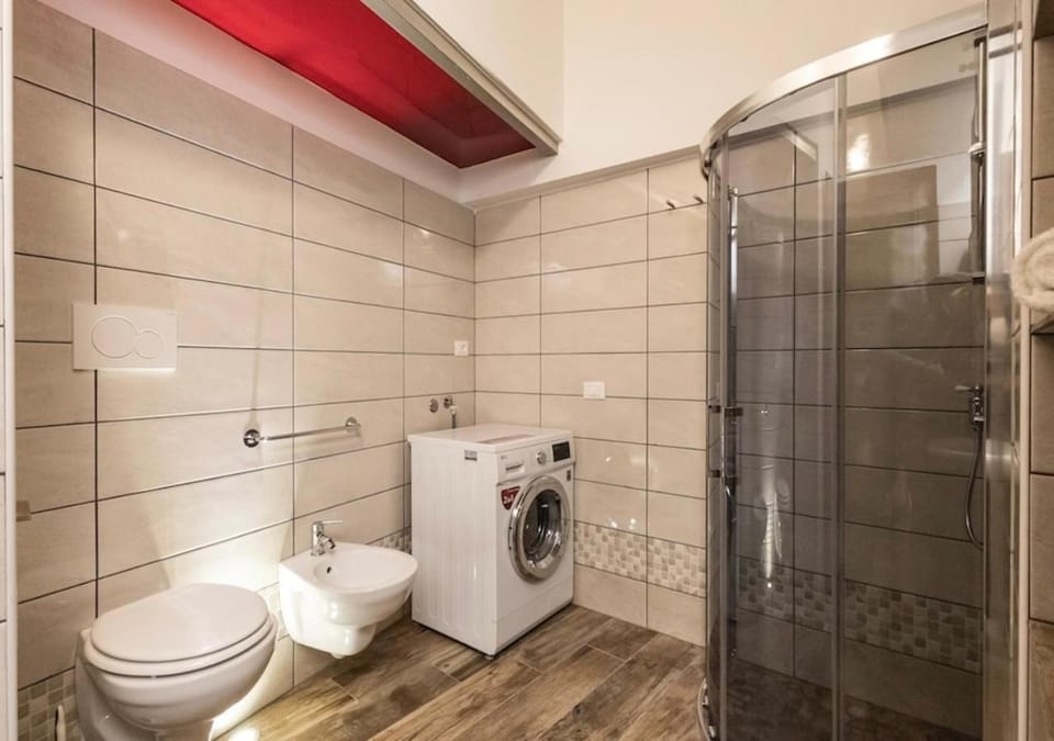 Shower, Toilet, Bathroom, bidet, towels, washing machine, dryer