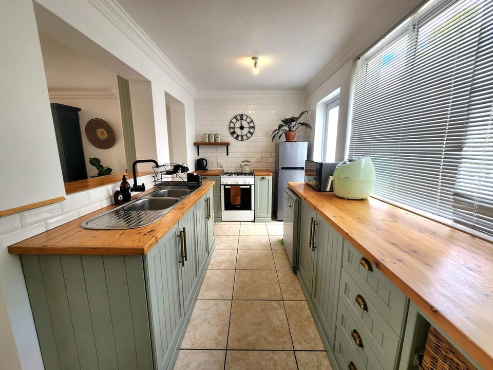 Kitchen or kitchenette, dishwasher, oven, stove, toaster