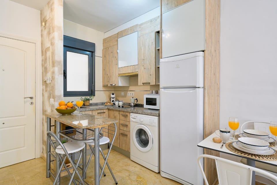Kitchen or kitchenette, stove, washing machine