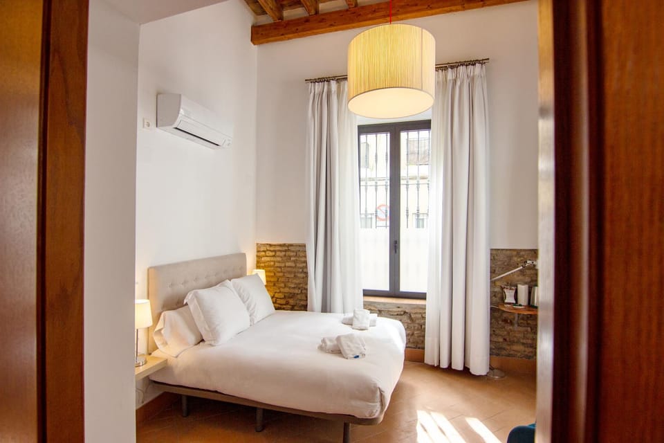 Bed, Photo of the whole room, Bedroom, towels, air conditioner