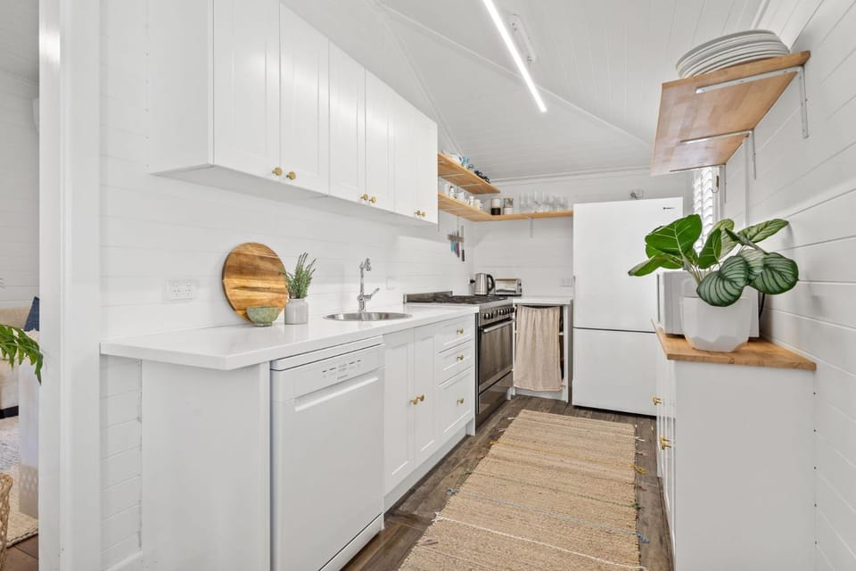 Kitchen or kitchenette, dishwasher, oven, stove