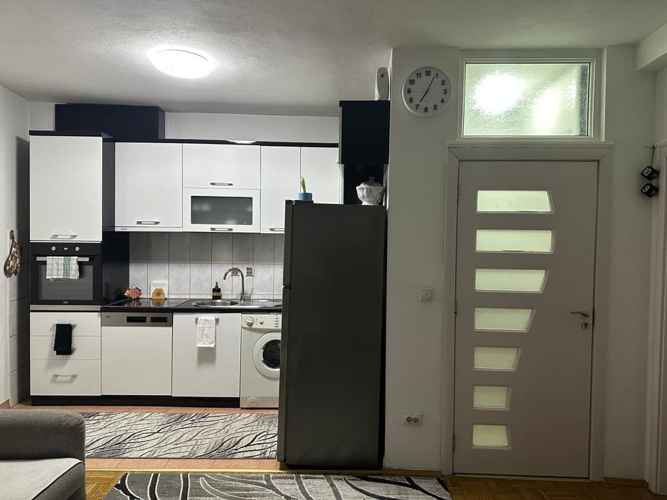 Kitchen or kitchenette, dishwasher, oven, stove