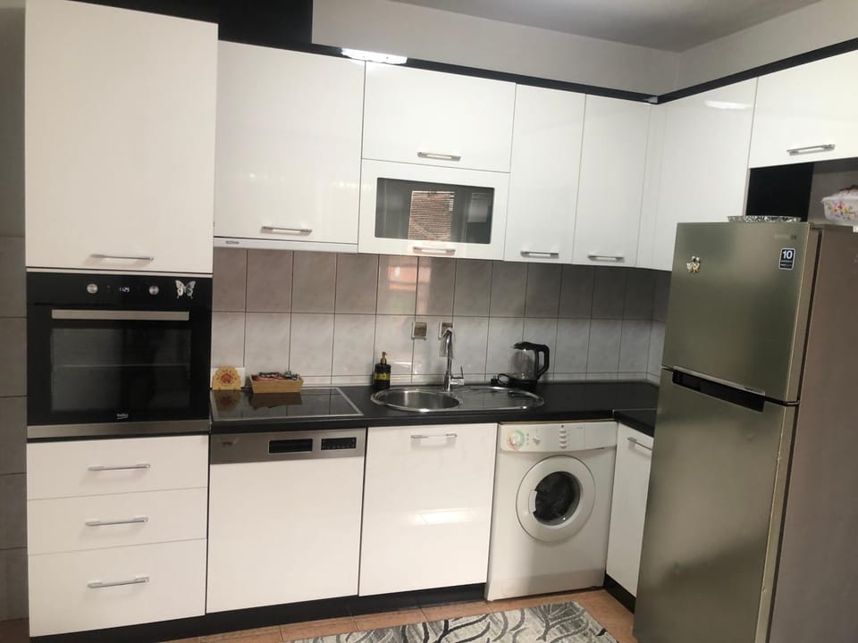 Kitchen or kitchenette, dishwasher, oven, stove, washing machine