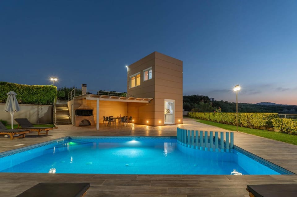Property building, Night, Natural landscape, Pool view, Swimming pool, Swimming pool, sunbed