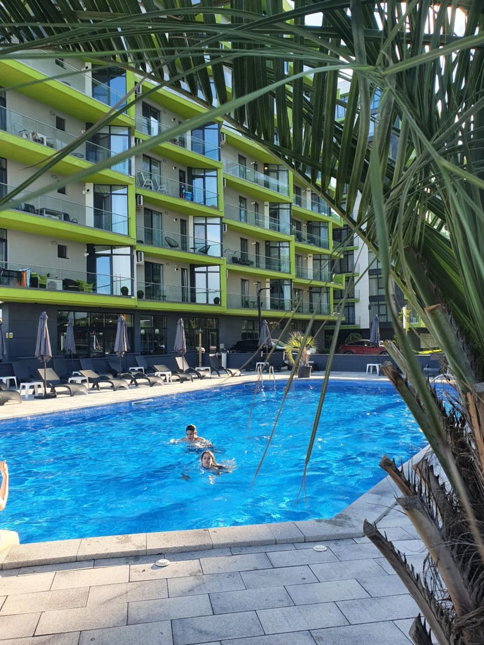 Swimming pool, sunbed