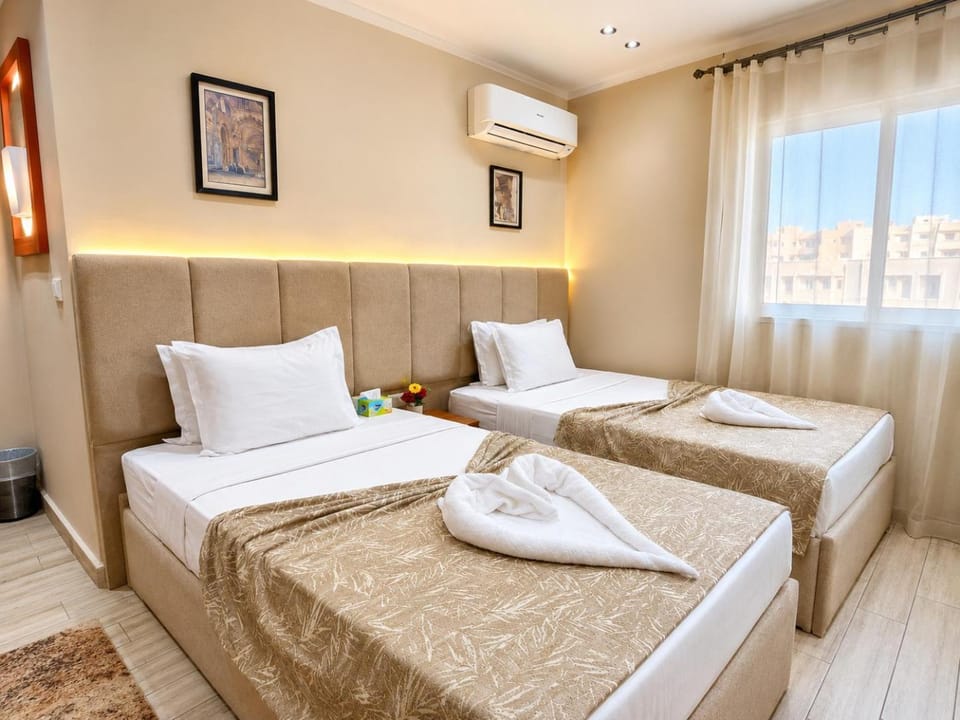 Bed, Photo of the whole room, Bedroom, towels, air conditioner