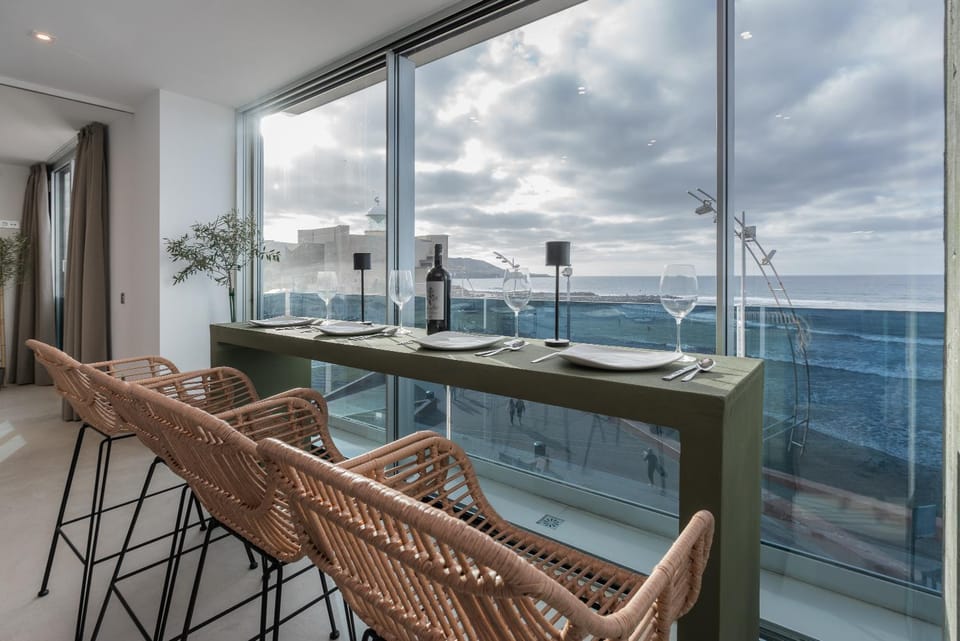 View (from property/room), Living room, Seating area, Dining area, Sea view
