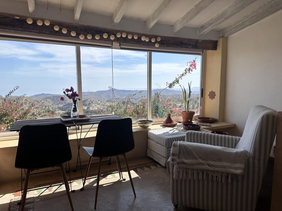 Natural landscape, View (from property/room), Living room, Seating area, Dining area, Mountain view, Sea view