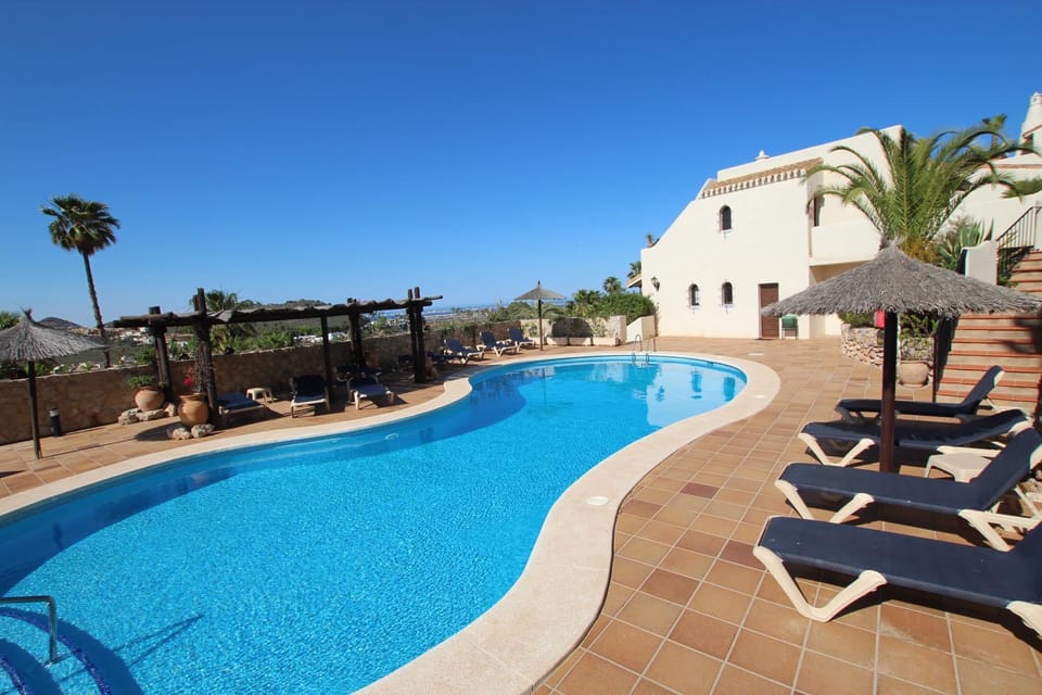 Patio, Day, Natural landscape, Pool view, Swimming pool, sunbed