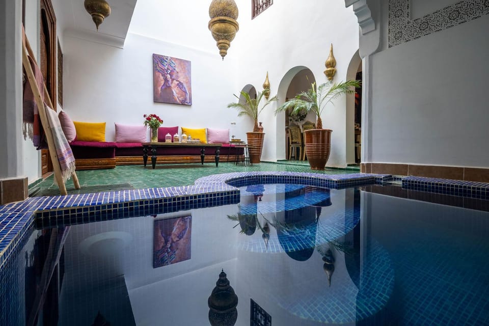 Property building, Living room, Seating area, Pool view, Swimming pool