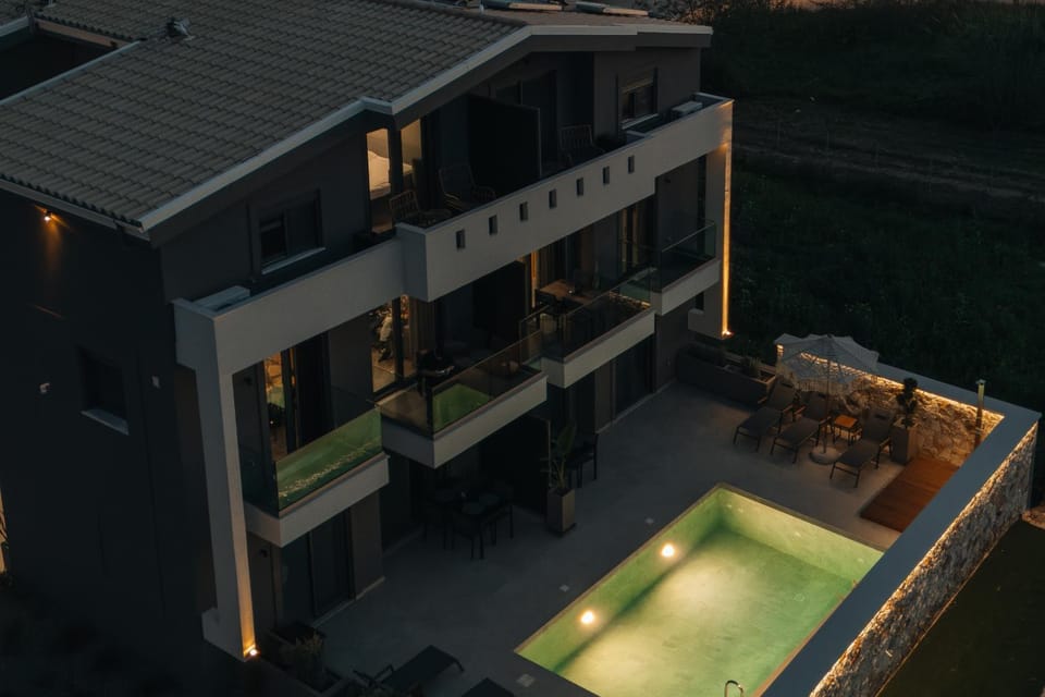 Property building, Patio, Night, Pool view, Swimming pool, sunbed