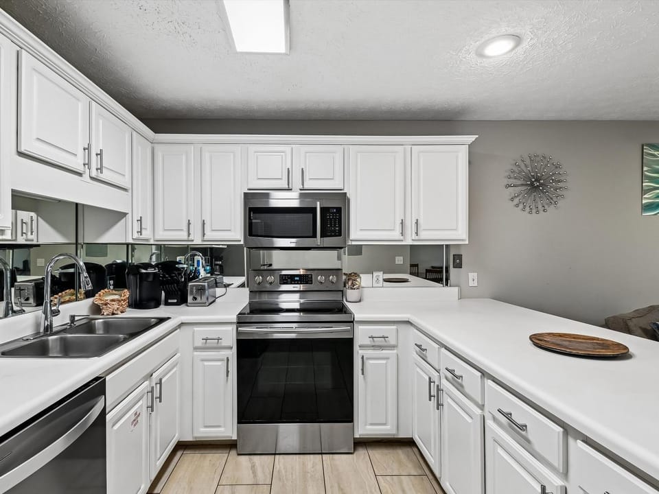 Kitchen or kitchenette, microwave, oven, stove, kitchen