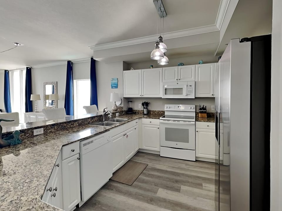 Kitchen or kitchenette, dishwasher, microwave, oven, stove, kitchen