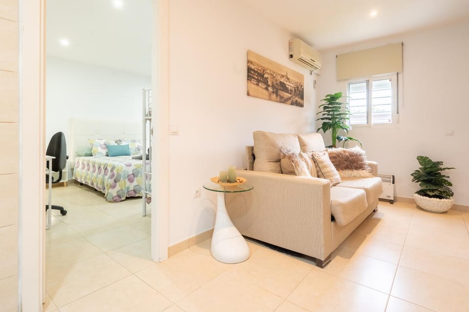 Bed, TV and multimedia, Living room, Seating area, air conditioner