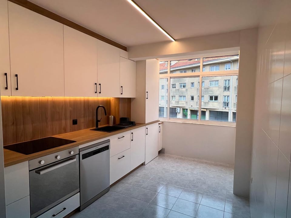 Kitchen or kitchenette, dishwasher, oven, stove, toaster