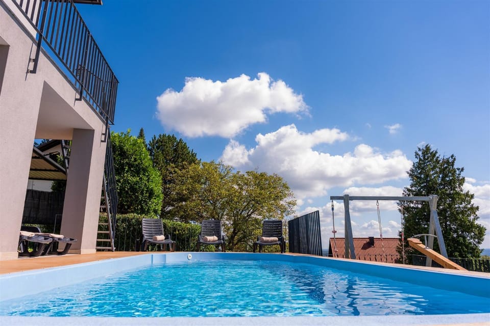 Property building, Day, Pool view, Swimming pool, sunbed